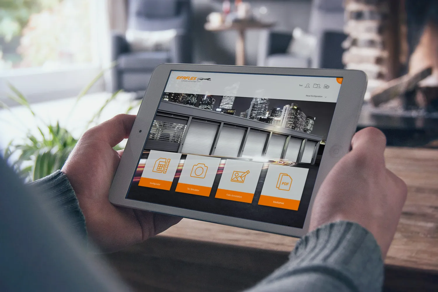 EFAFLEX sales app on an iPad held in two hands